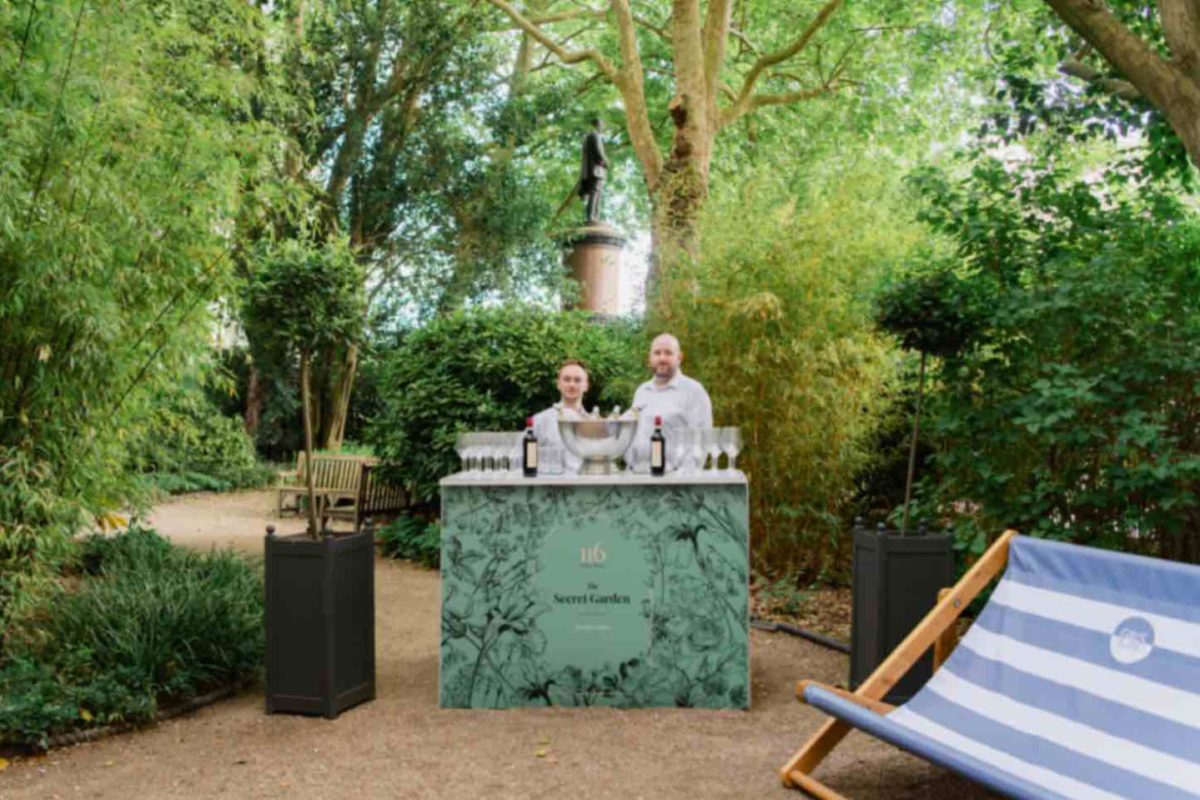 two staff members at the outdoor bar at the terrace of 116 Pall Mall